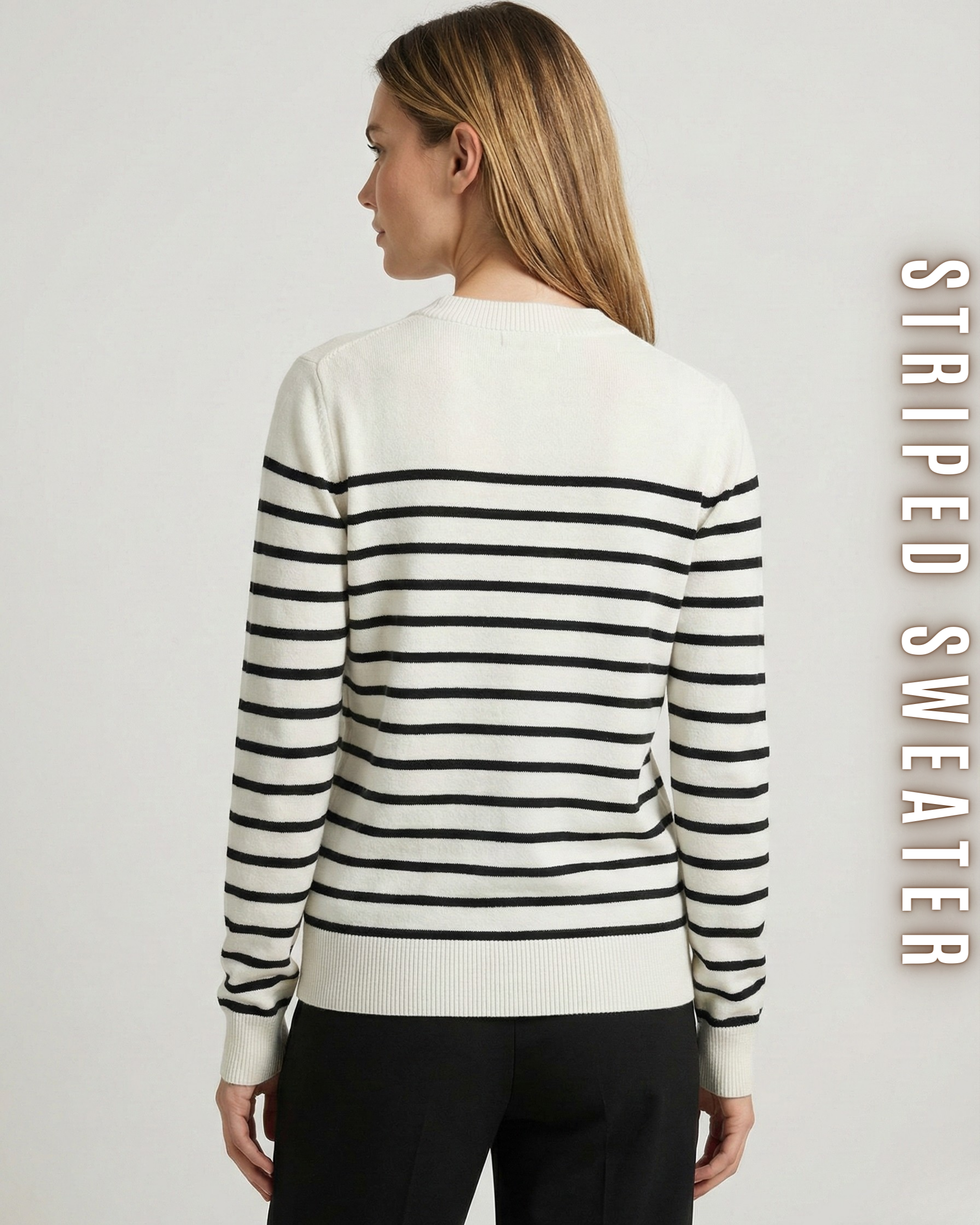 Rückansicht des gestreiften Strickpullovers an einem Model mit langen Haaren.