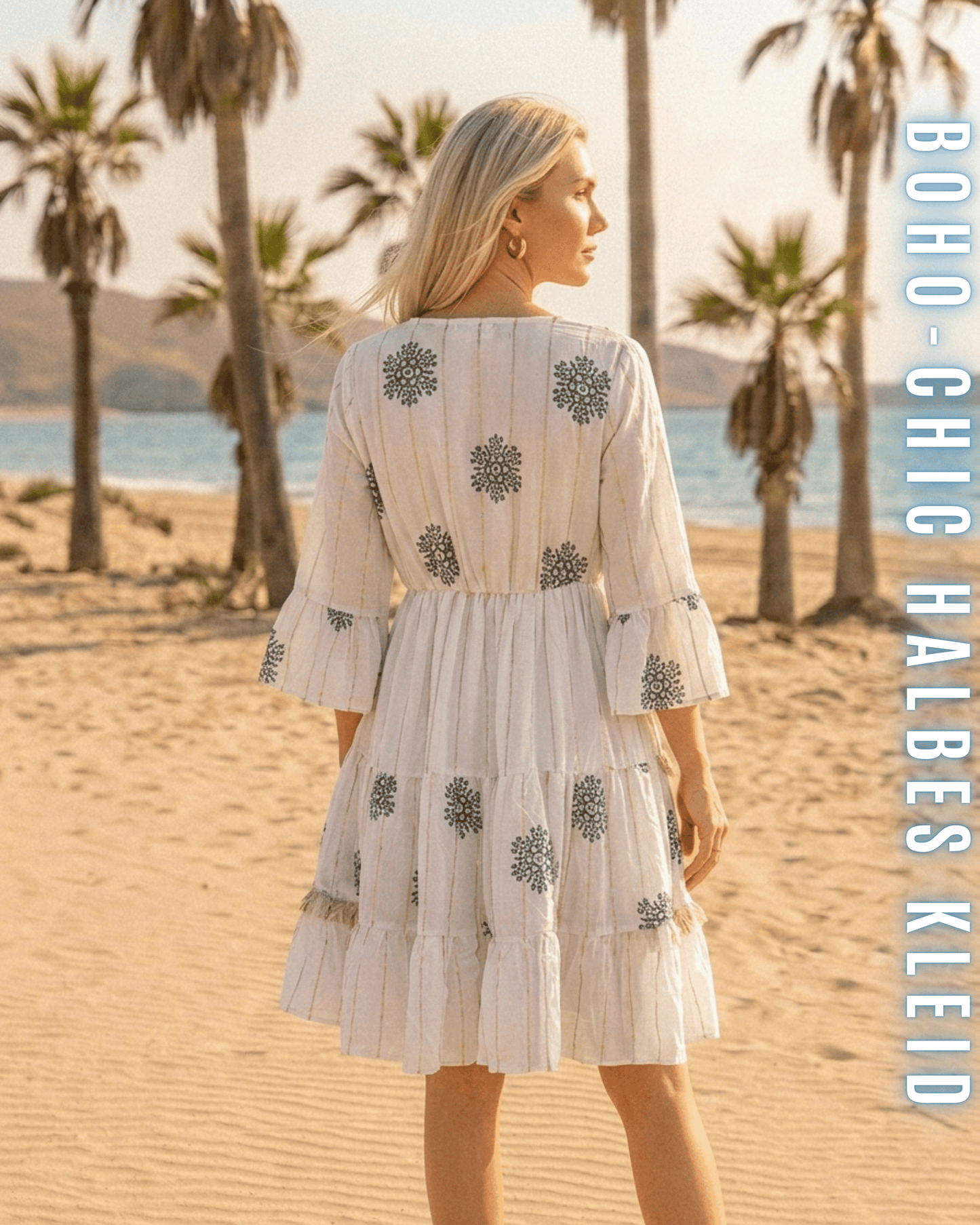 Rückansicht eines weißen Kurz-Kleides mit floralen Stick-Elementen.