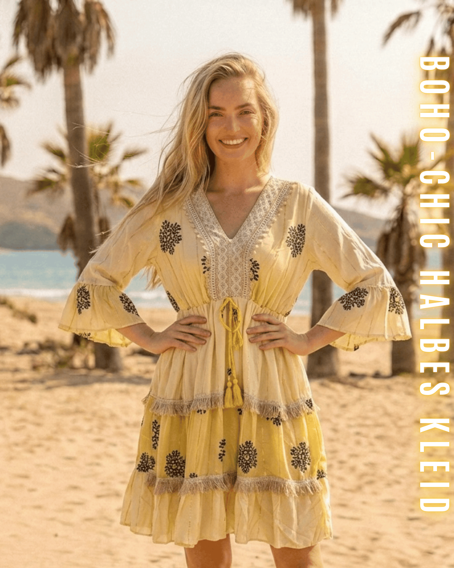 Sonnengelbes Tunikakleid im Boho-Stil mit schwarzen Ornamenten und Kordelzug.