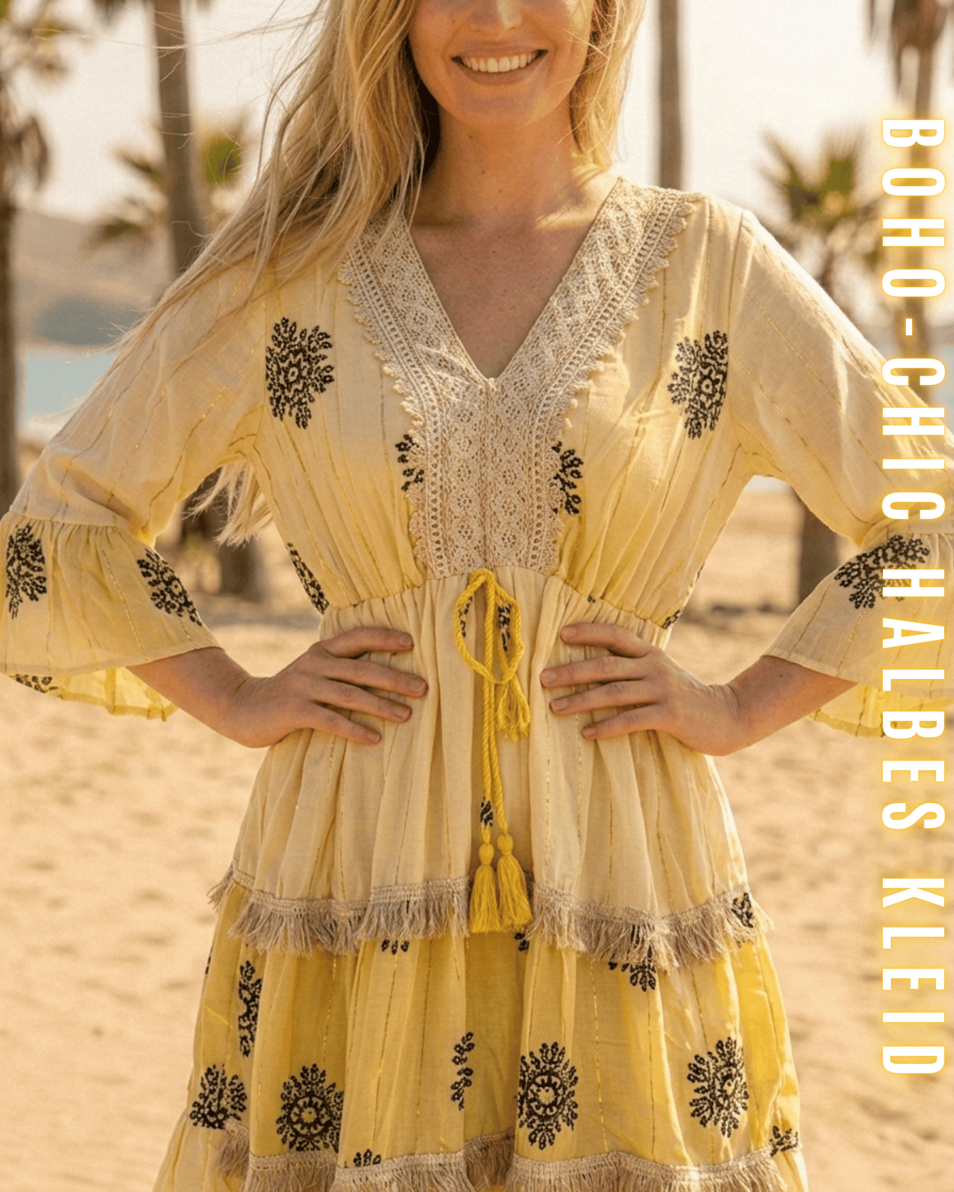 Sonnengelbes Tunikakleid im Boho-Stil mit schwarzen Ornamenten und Kordelzug.